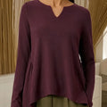 Women's Solid Color V-neck Long-sleeved Casual Loose-fitting Top With Irregular Hem.