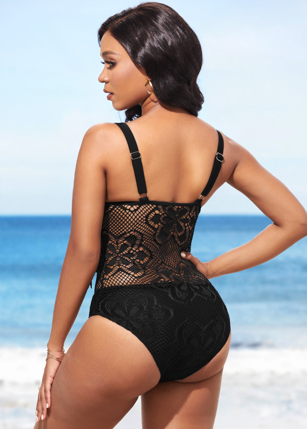 Maillot de bain une pièce noir à empiècements de dentelle et de pompons